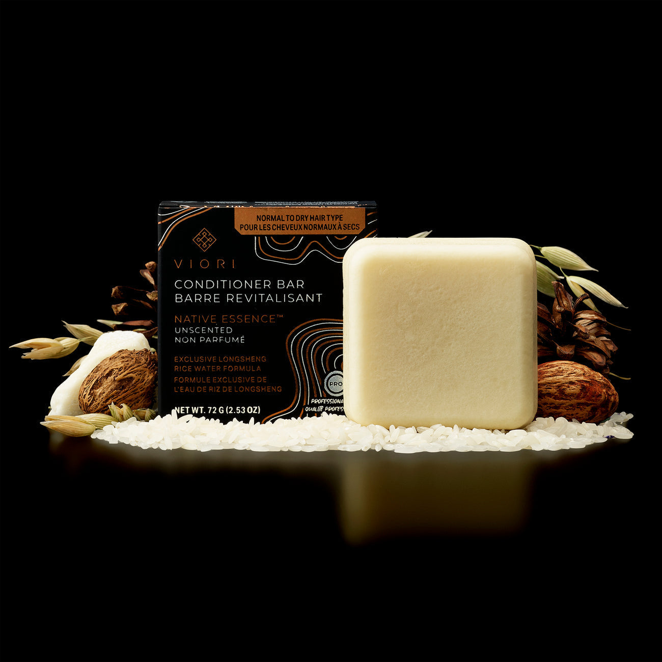 Viori Native Essence conditioner bar with packaging, surrounded by rice grains and natural ingredients on black background