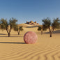 EPS bee hive shaped round pink bar in desert sand with olive trees and adobe castle in background