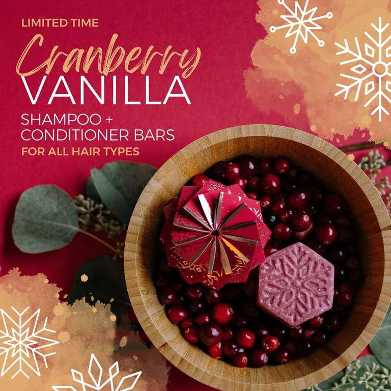 EPS bee hive shaped cranberry vanilla shampoo and conditioner bars in wooden bowl with cranberries