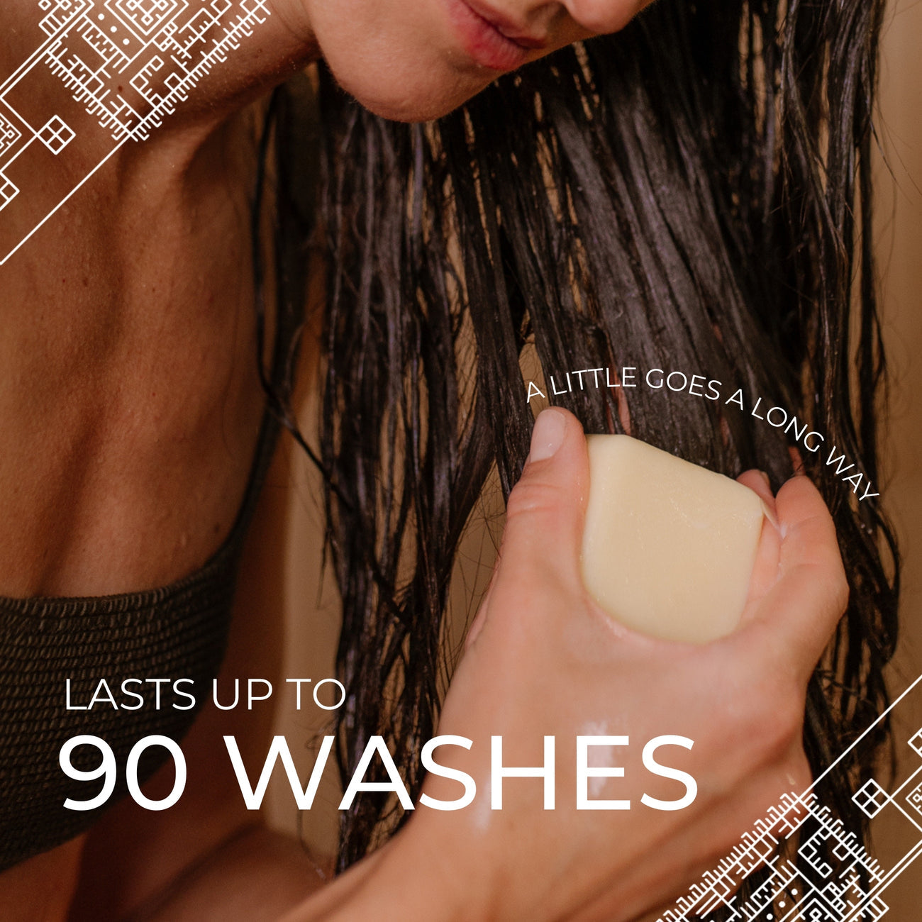 Person applying moisturizing and repair conditioner bar to wet hair, text says lasts up to 90 washes