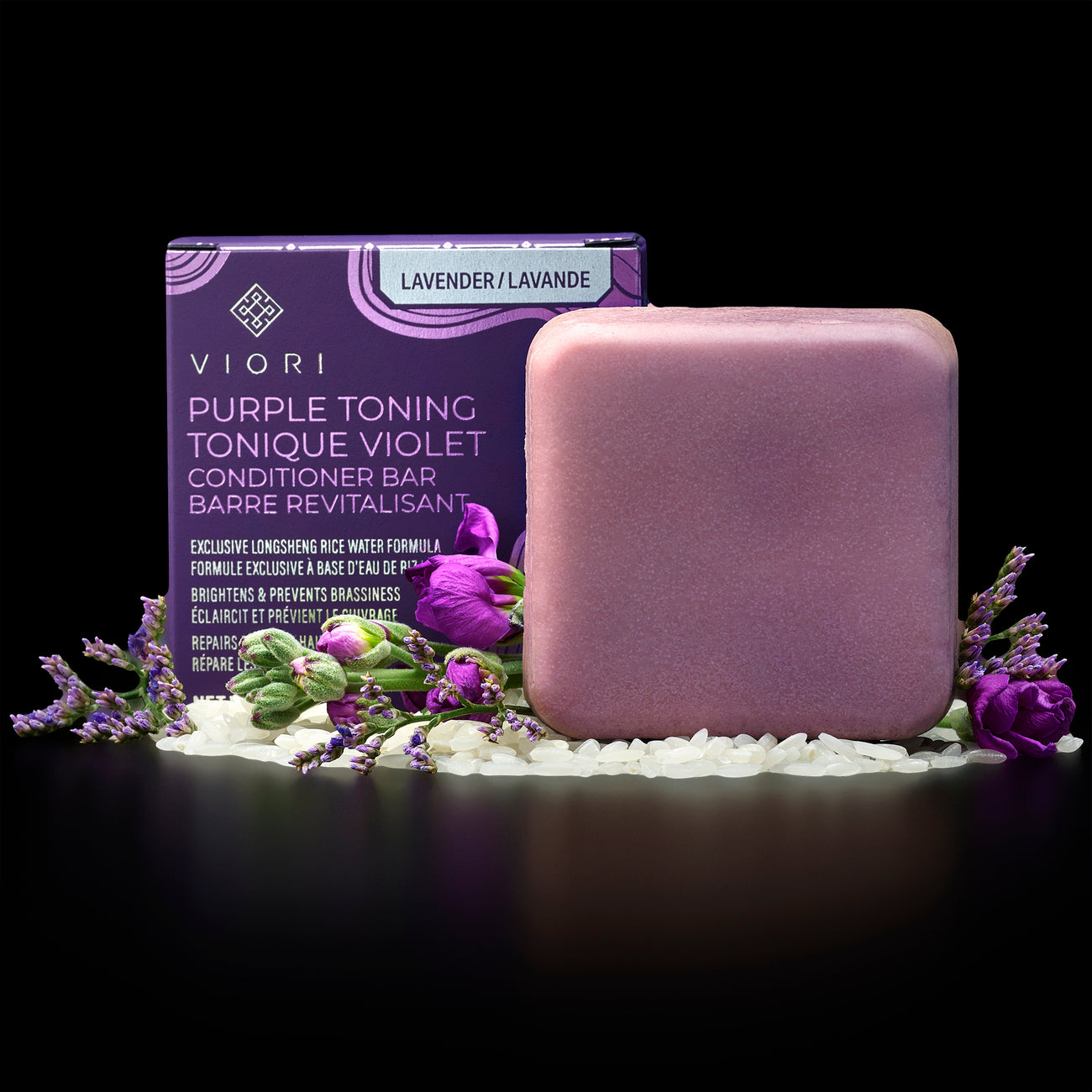 Viory purple toning lavender conditioner bar with rice grains and purple flowers on black background